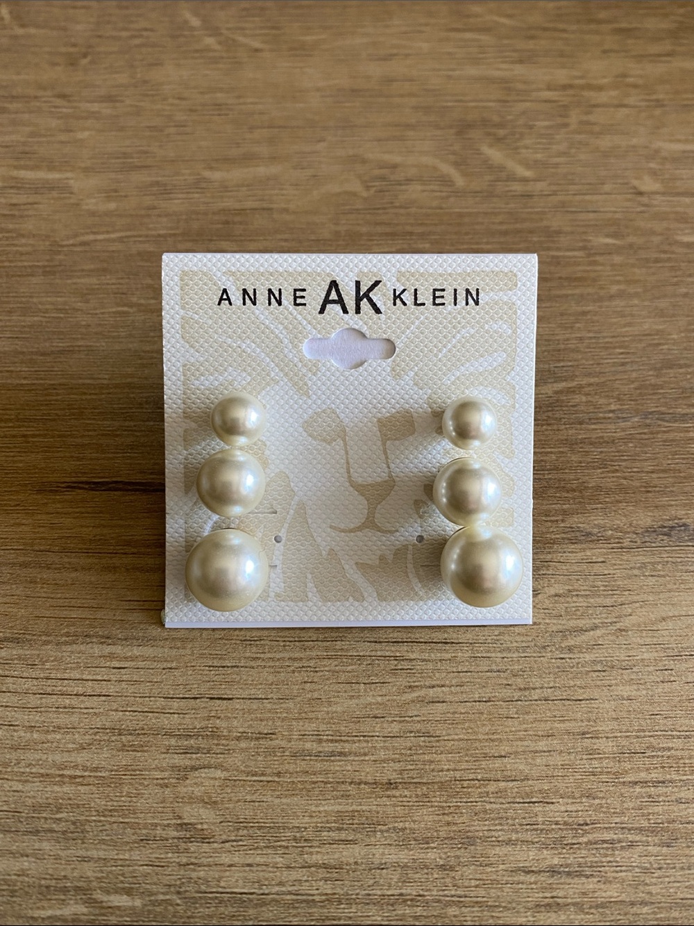 Anne Klein three pairs of pearl ivory colored earrings